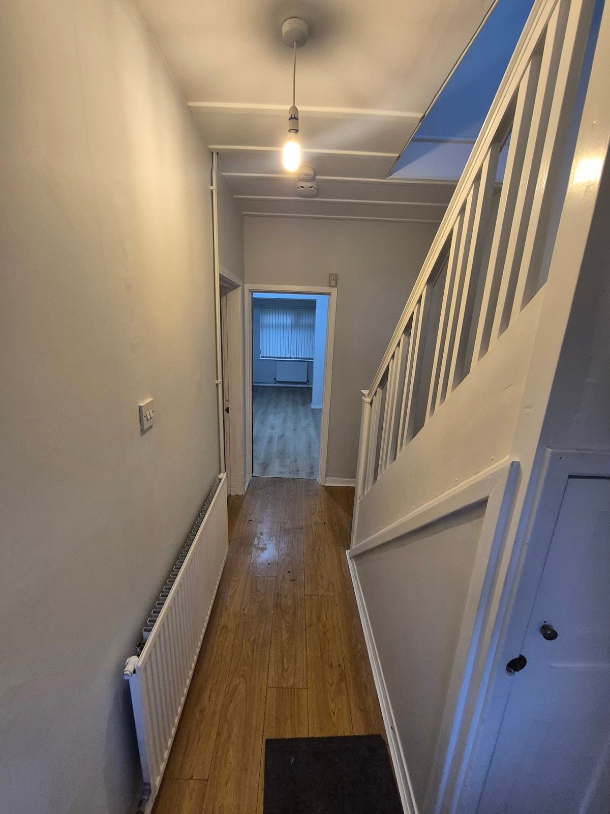 After — Loft room repaint at Austen Walk, Lincoln — exposed beams and new flooring