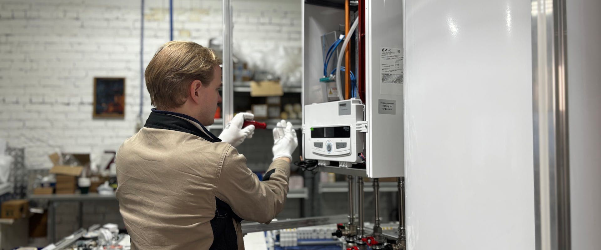 Gas Safe engineer servicing a heating system — annual CP12 landlord gas safety inspection