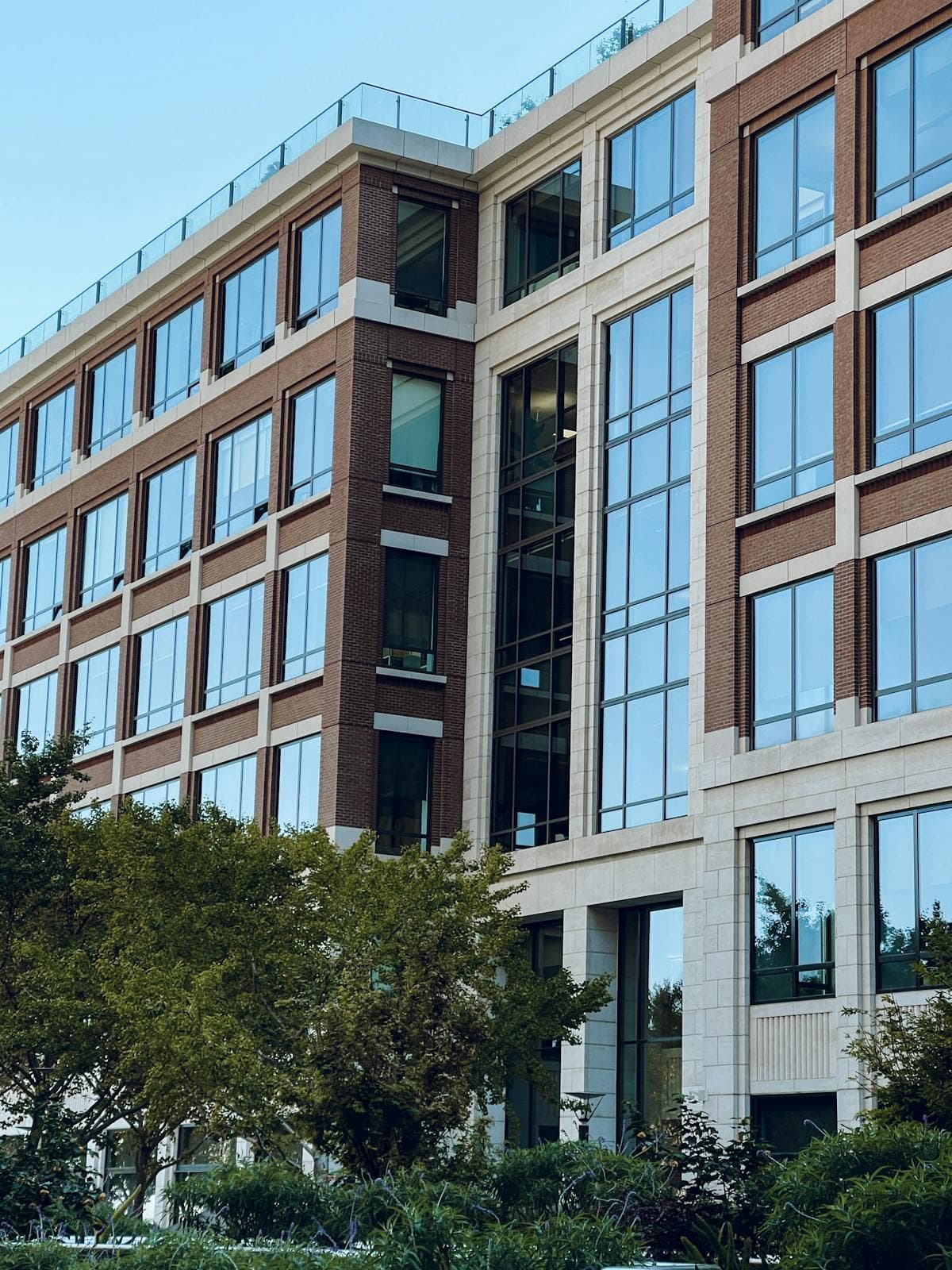 Modern commercial office building exterior — schedule of dilapidations and lease-end reinstatement works