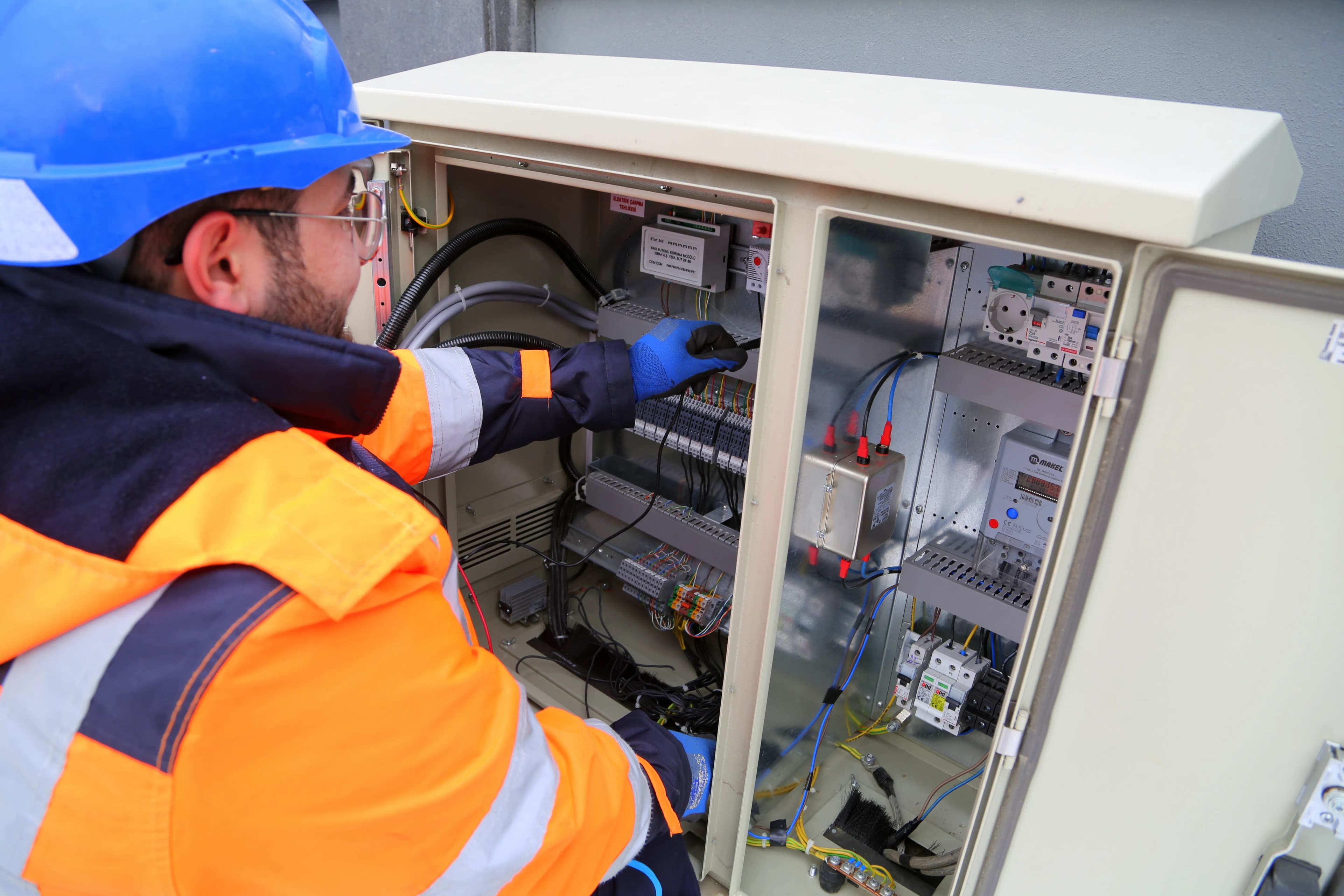 Electrician inspecting a domestic consumer unit