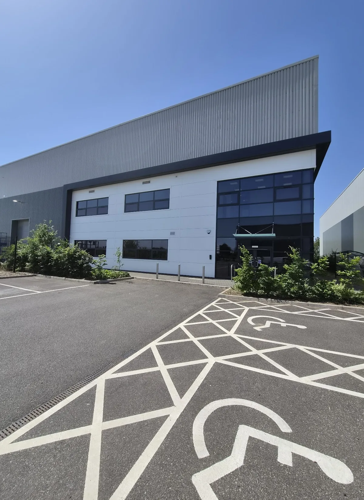 Maintained shrub borders around the car park of a commercial unit in Lincolnshire